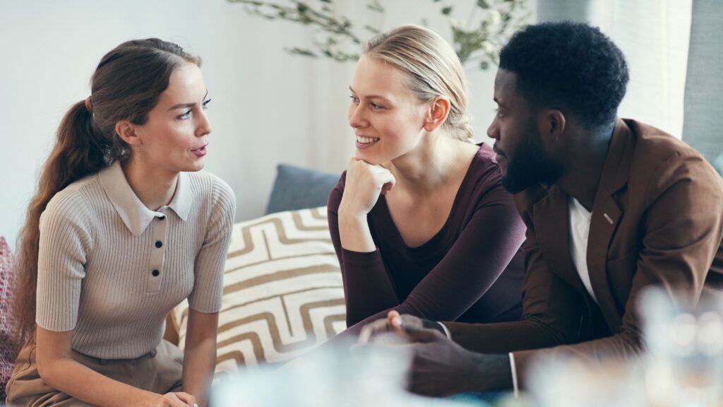 Image of an Airbnb host chatting with guests