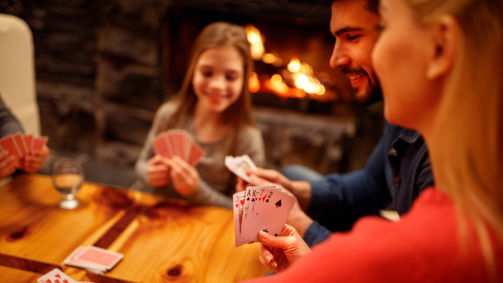 Image of family playing games in a cosy Airbnb